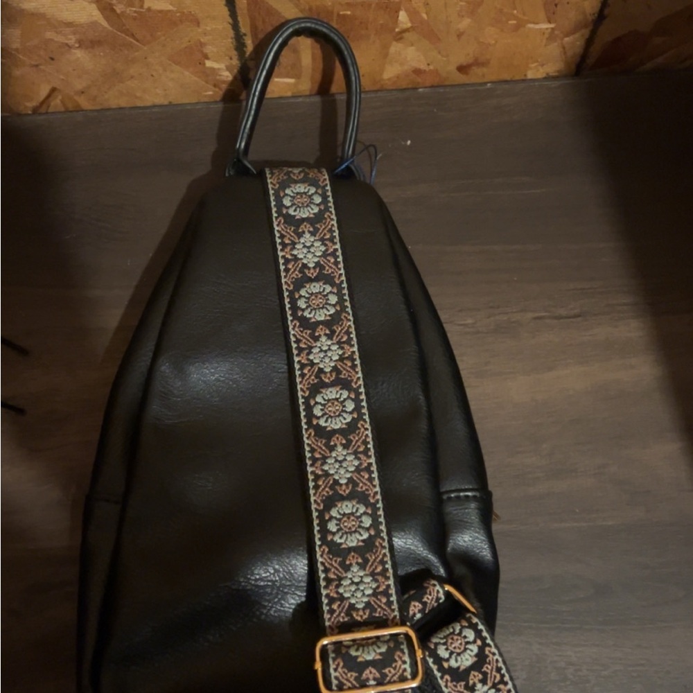 Black Backpack With Patterned Strap - image 1